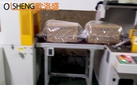 整箱干燥劑熱收縮包膜機(jī)案例視頻